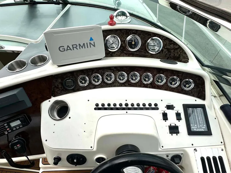 Slide: The Image of Cockpit of 1999 Wellcraft 45 Excalibur with Garmin navigation system and control panel. - 19