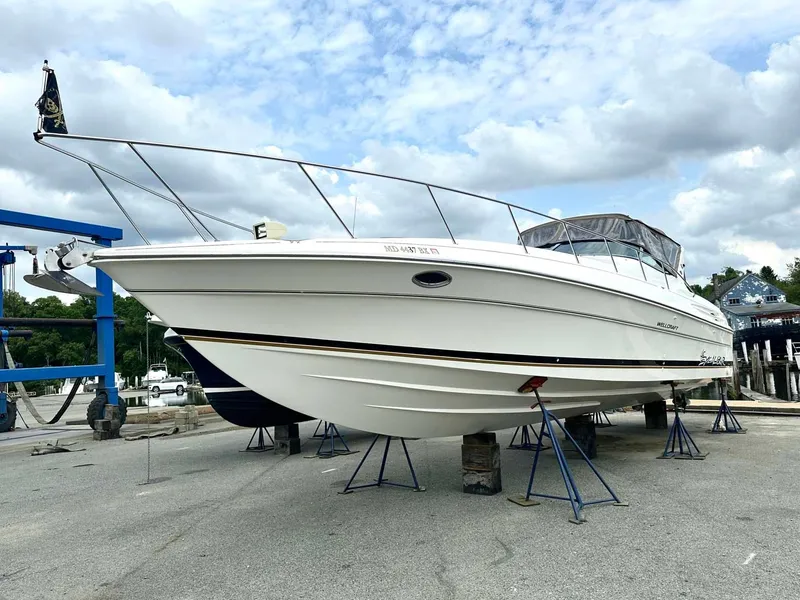 Slide: The Image of 1999 Wellcraft 45 Excalibur boat on stands, ready for maintenance. - 2