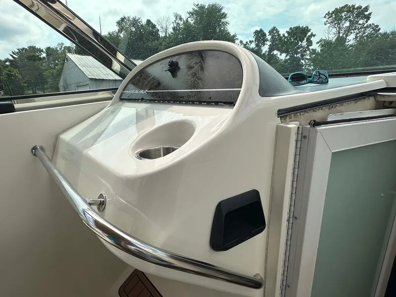 Slide: The Image of 1999 Wellcraft 45 Excalibur boat dashboard with sleek design and chrome accents. - 21