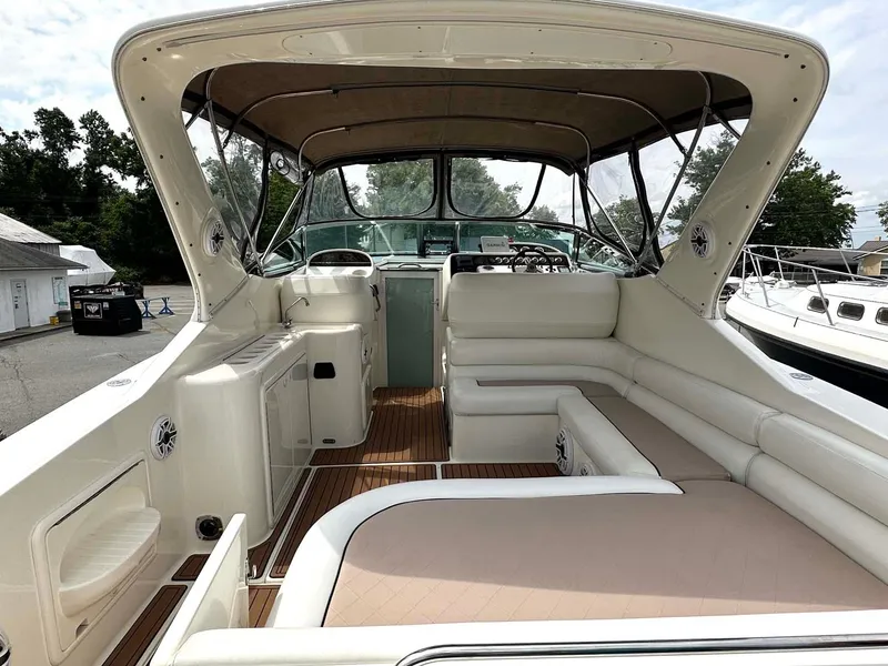 Slide: The Image of 1999 Wellcraft 45 Excalibur boat interior with spacious seating and helm. - 28