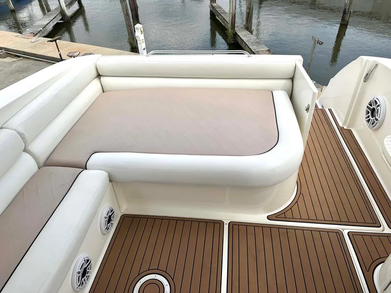 Slide: The Image of 1999 Wellcraft 45 Excalibur boat interior with cushioned seating and teak flooring. - 29
