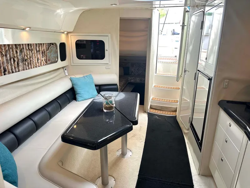 Slide: The Image of Interior of 1999 Wellcraft 45 Excalibur yacht with modern seating and sleek design. - 3