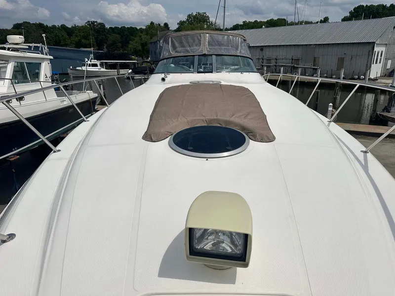 Slide: The Image of 1999 Wellcraft 45 Excalibur yacht docked at marina, front deck view. - 31