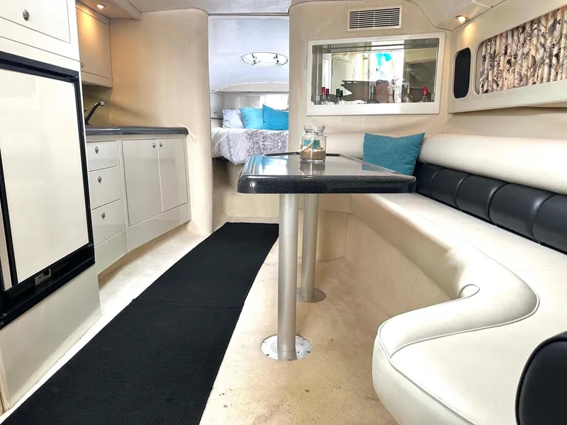 Slide: The Image of Luxurious interior of 1999 Wellcraft 45 Excalibur yacht with modern kitchen and seating area. - 4