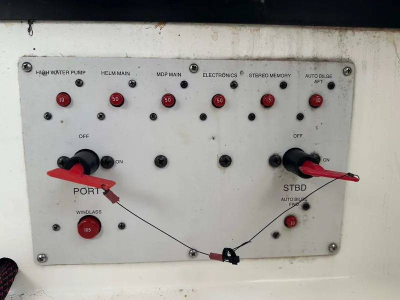 Slide: The Image of Control panel of a 1999 Wellcraft 45 Excalibur boat with switches and indicators. - 41