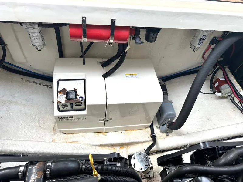 Slide: The Image of 1999 Wellcraft 45 Excalibur engine compartment with Kohler power system. - 42