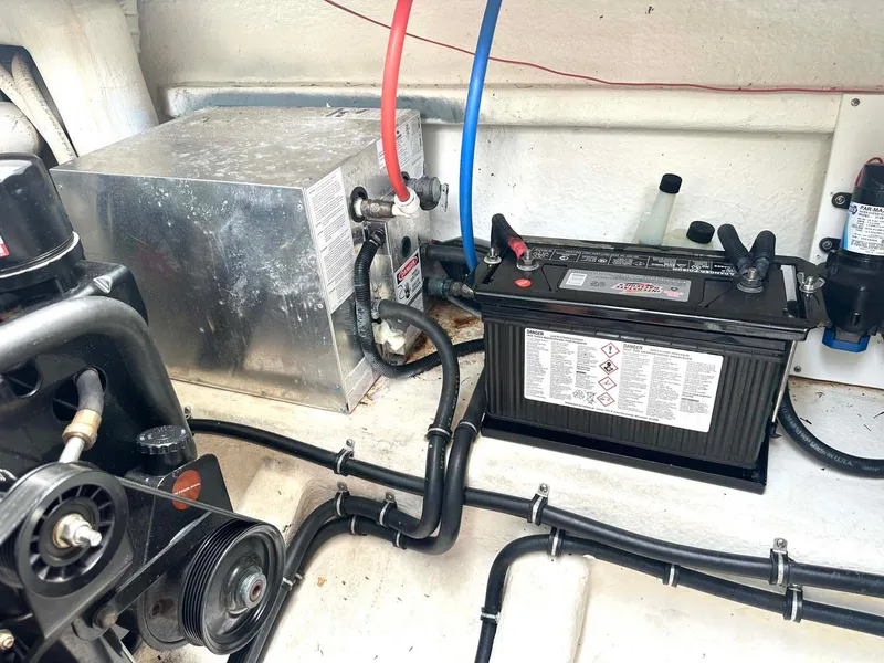 Slide: The Image of Engine compartment of 1999 Wellcraft 45 Excalibur with battery and wiring. - 44