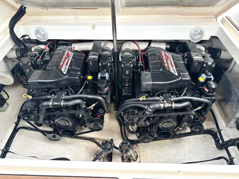 Slide: The Image of Twin engines of a 1999 Wellcraft 45 Excalibur boat, showcasing powerful performance. - 46