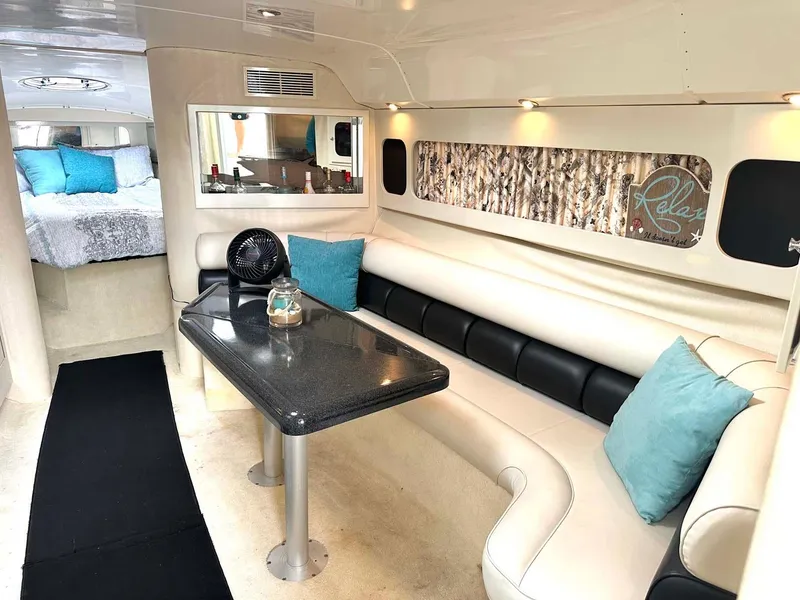 Slide: The Image of Luxurious interior of 1999 Wellcraft 45 Excalibur yacht with elegant seating and decor. - 5