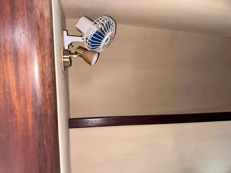 Slide: The Image of Interior of 1998 Fountaine Pajot Athena 38 with wall-mounted fan and light fixture. - 14