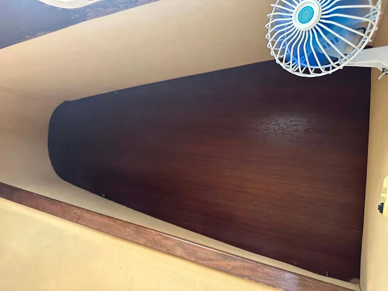 Slide: The Image of Interior cabin of 1998 Fountaine Pajot Athena 38 with wooden paneling and small fan. - 15