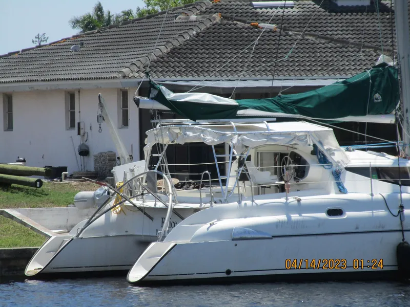 Slide: The Image of Fountaine Pajot Athena 38 catamaran docked near a house, April 2023. - 24