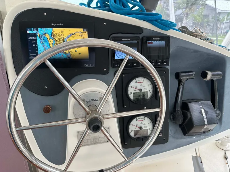 Slide: The Image of Steering wheel and navigation instruments on 1998 Fountaine Pajot Athena 38 catamaran. - 26