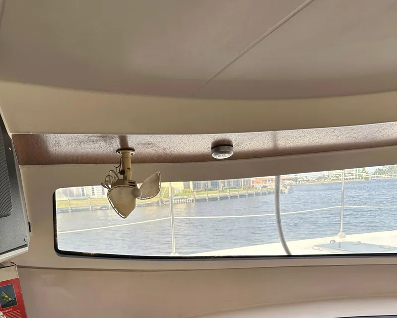 Slide: The Image of Interior view of 1998 Fountaine Pajot Athena 38 catamaran with window and fan. - 3