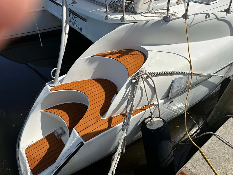 Slide: The Image of Fountaine Pajot Athena 38 catamaran, 1998 model, docked with wooden deck steps. - 36