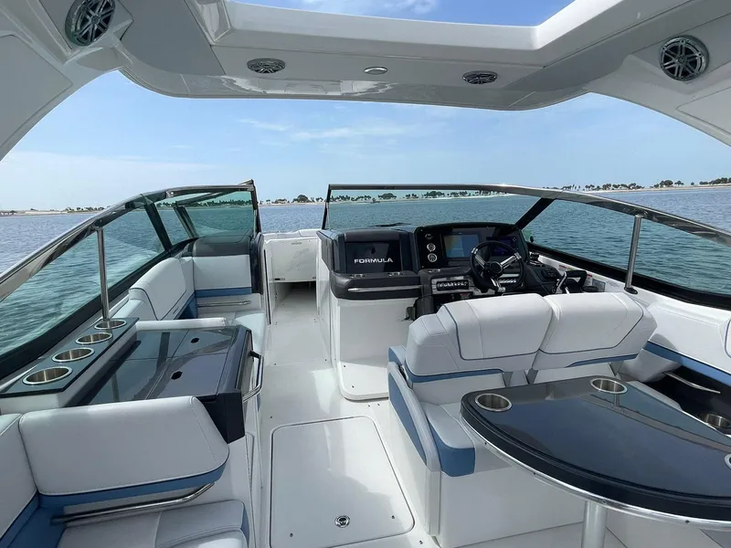 Slide: The Image of 2023 Formula 330 Crossover Bowrider OB interior with luxurious seating and modern dashboard. - 32