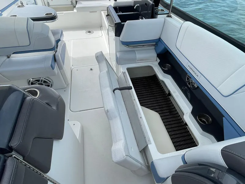 Slide: The Image of 2023 Formula 330 Crossover Bowrider OB interior with open storage compartment. - 36
