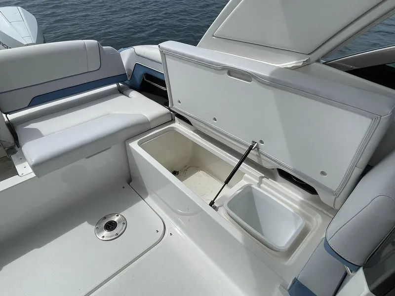 Slide: The Image of 2023 Formula 330 Crossover Bowrider OB interior with open storage compartment. - 37