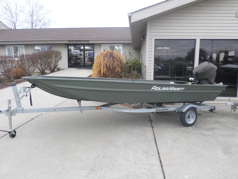 Slide: The Image of 2024 Polar Kraft DKMV 1648 boat on trailer outside showroom. - 1