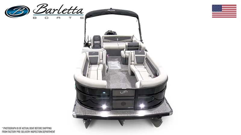 Slide: The Image of 2025 Barletta Cabrio 24U pontoon boat, sleek design, spacious seating, American flag displayed. - 5