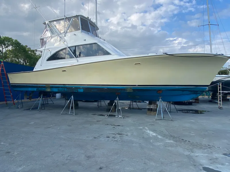 Slide: The Image of 1992 Ocean Yachts 48 Convertible boat on stands, ready for maintenance. - 0