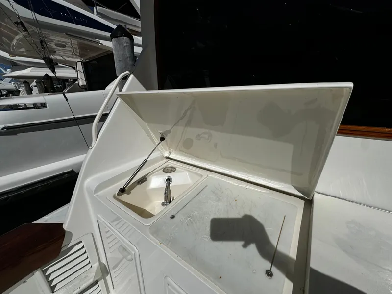 Slide: The Image of 1992 Ocean Yachts 48 Convertible yacht sink area with open lid. - 44