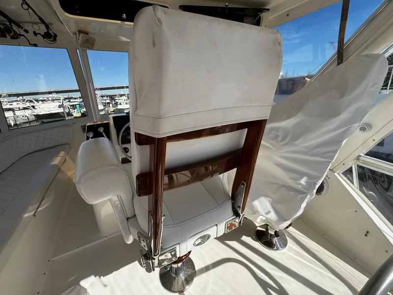Slide: The Image of Interior of 1992 Ocean Yachts 48 Convertible, featuring captain's chair and helm station. - 49