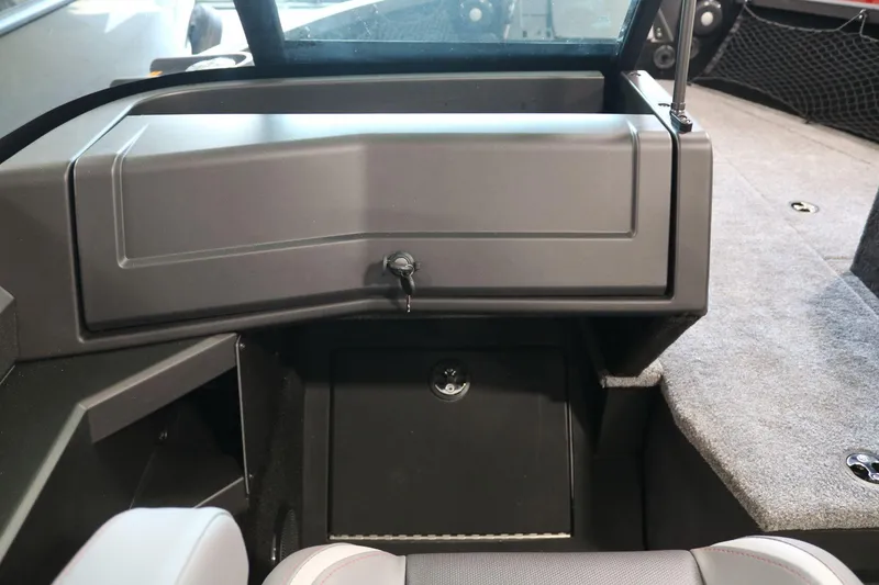 Slide: The Image of 2025 Alumacraft Competitor 175X Sport interior storage compartment with sleek design and durable materials. - 13