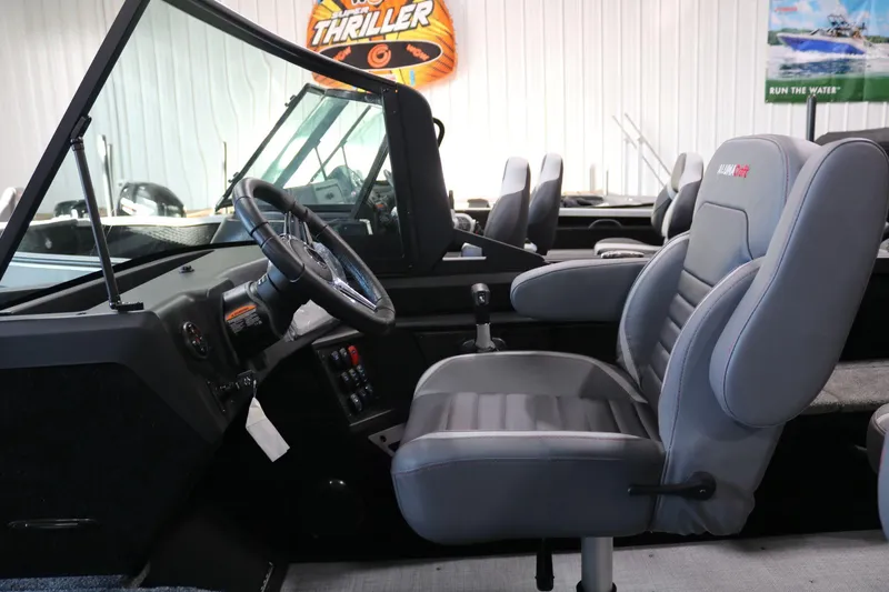 Slide: The Image of 2025 Alumacraft Competitor 175X Sport interior with steering wheel and seating. - 14