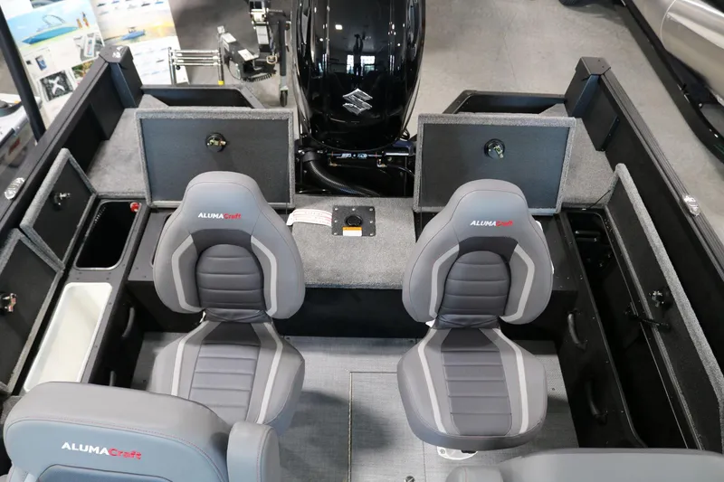 Slide: The Image of Interior of 2025 Alumacraft Competitor 175X Sport boat with seating and storage compartments. - 18