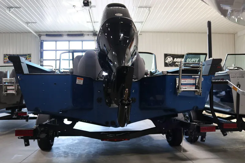 Slide: The Image of 2025 Alumacraft Competitor 175X Sport boat in showroom, rear view. - 5