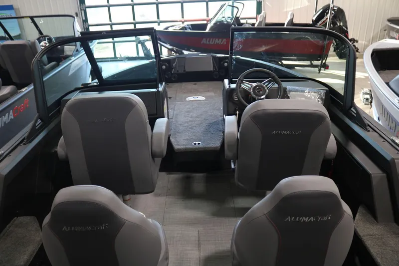 Slide: The Image of 2025 Alumacraft Competitor 175X Sport interior with seating and steering wheel. - 6