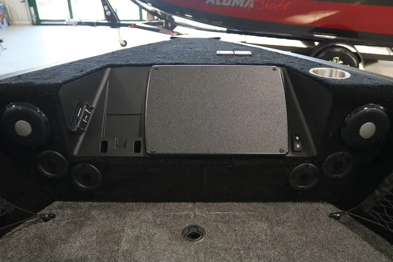 Slide: The Image of 2025 Alumacraft Competitor 175X Sport boat interior with speakers and storage compartments. - 8