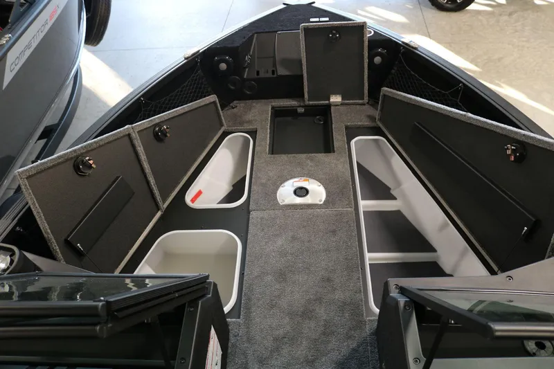 Slide: The Image of 2025 Alumacraft Competitor 175X Sport boat interior with open storage compartments. - 9