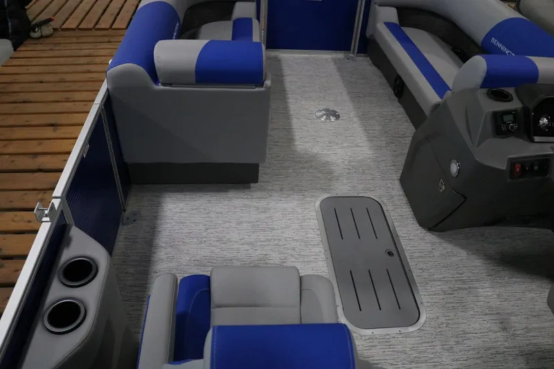 Slide: The Image of Interior of 2025 Bennington 22 S STERN RADIUS pontoon boat with blue and gray seating. - 10