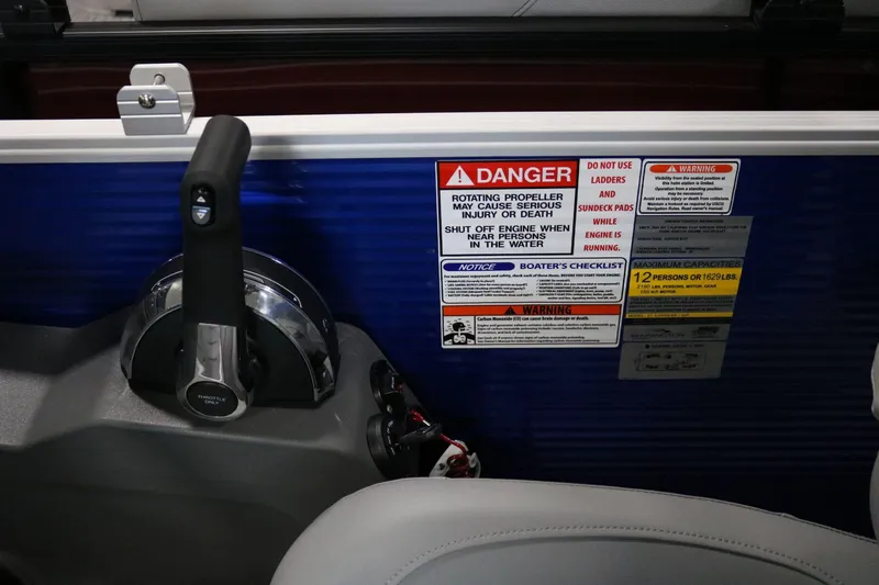 Slide: The Image of Bennington 22 S STERN RADIUS 2025 boat controls with safety warnings and capacity details. - 14