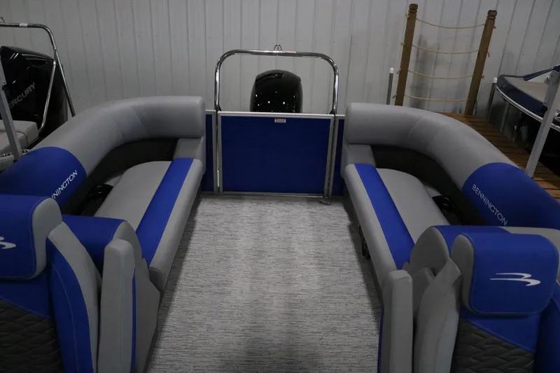 Slide: The Image of 2025 Bennington 22 S STERN RADIUS boat interior with blue and gray seating. - 16