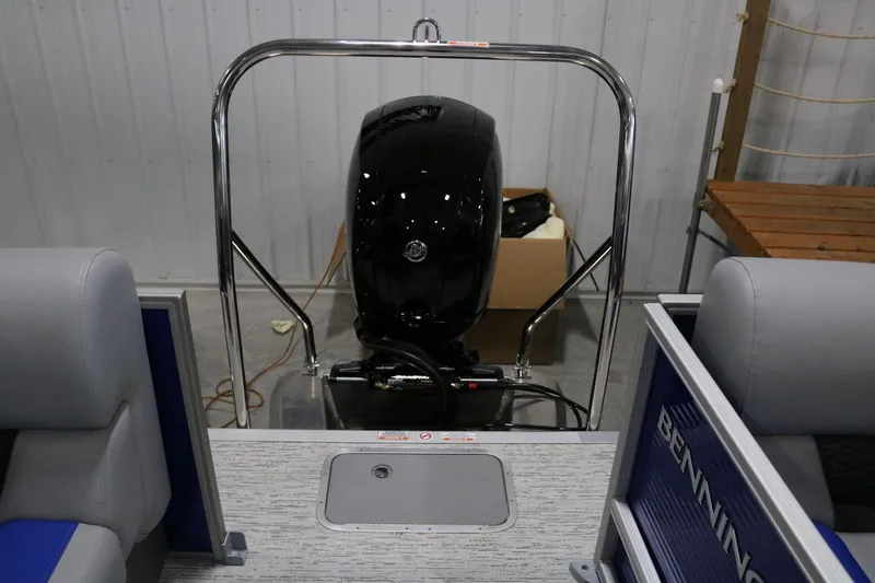 Slide: The Image of 2025 Bennington 22 S STERN RADIUS boat interior with motor view. - 19