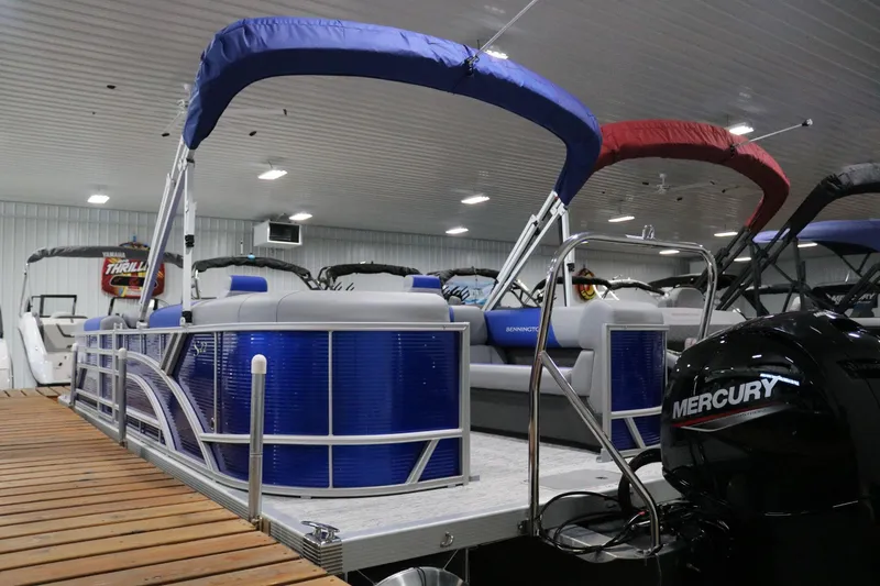 Slide: The Image of 2025 Bennington 22 S STERN RADIUS pontoon boat with Mercury engine in showroom. - 3