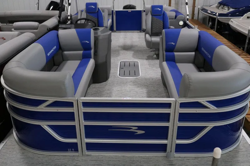 Slide: The Image of 2025 Bennington 22 S STERN RADIUS pontoon boat with blue and gray seating. - 4