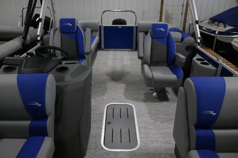 Slide: The Image of 2025 Bennington 22 S STERN RADIUS pontoon boat interior with blue and gray seating. - 7