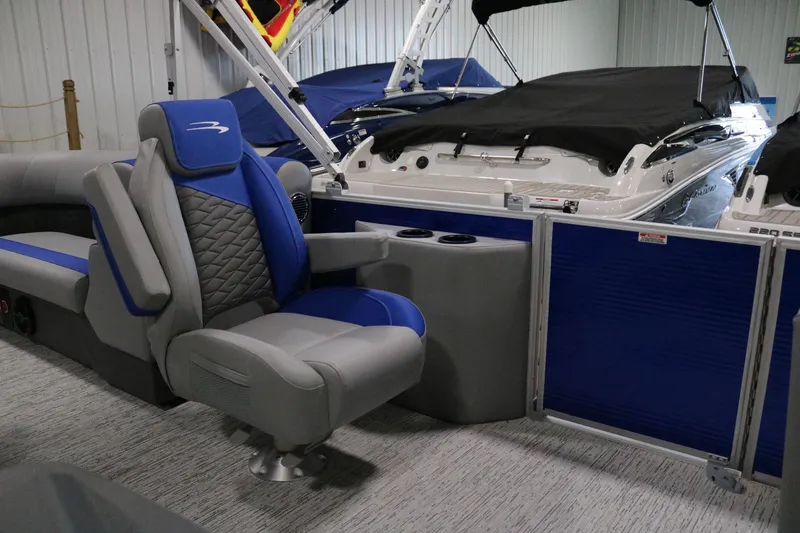 Slide: The Image of 2025 Bennington 22 S STERN RADIUS boat interior with blue and gray seating. - 9
