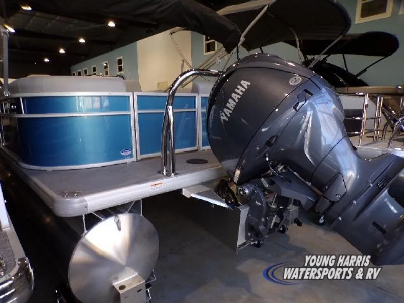 Slide: The Image of 2025 Godfrey EX2286SB pontoon boat with Yamaha outboard motor in showroom. - 12