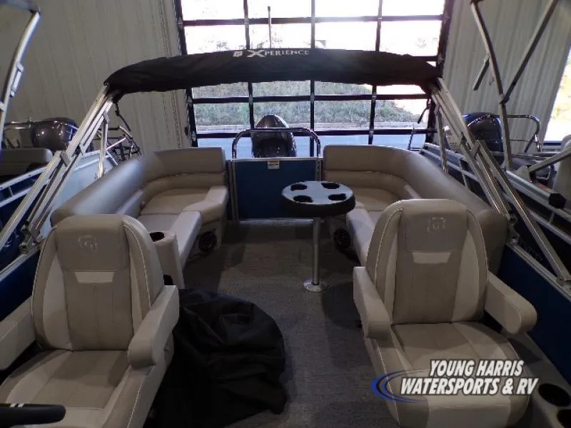 Slide: The Image of 2025 Godfrey EX2286SB pontoon boat interior with seating and table. - 4