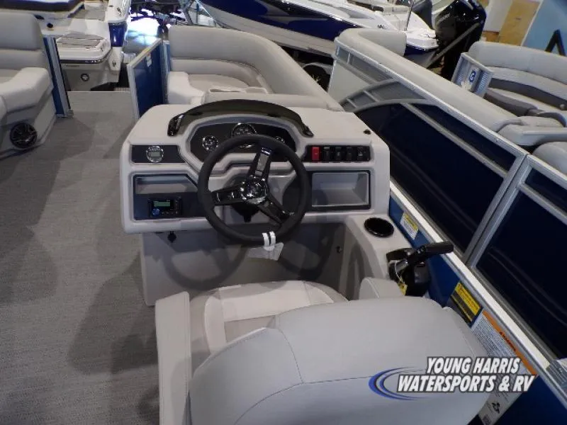 Slide: The Image of 2025 Godfrey EX2286SB boat interior with steering wheel and seating at Young Harris Watersports & RV. - 5