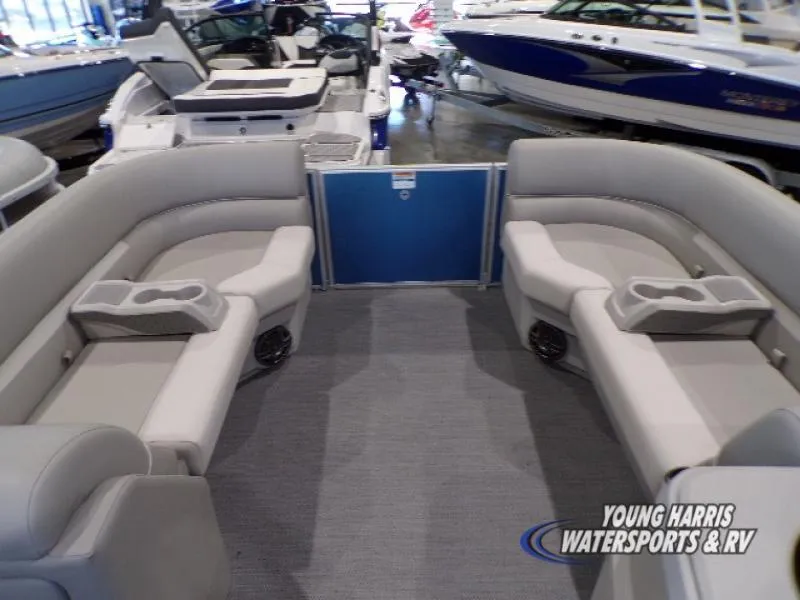 Slide: The Image of 2025 Godfrey EX2286SB pontoon boat interior with gray seating and cup holders. - 7