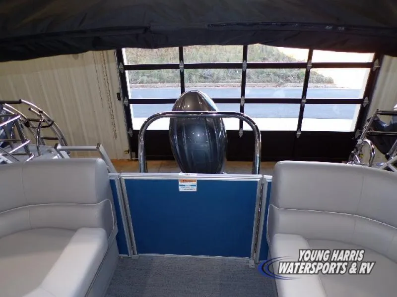 Slide: The Image of 2025 Godfrey EX2286SB pontoon boat interior with seating and rear view. - 9