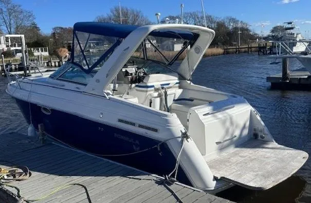 The Image of 2003 Formula 27 PC boat docked on a sunny day. - 0