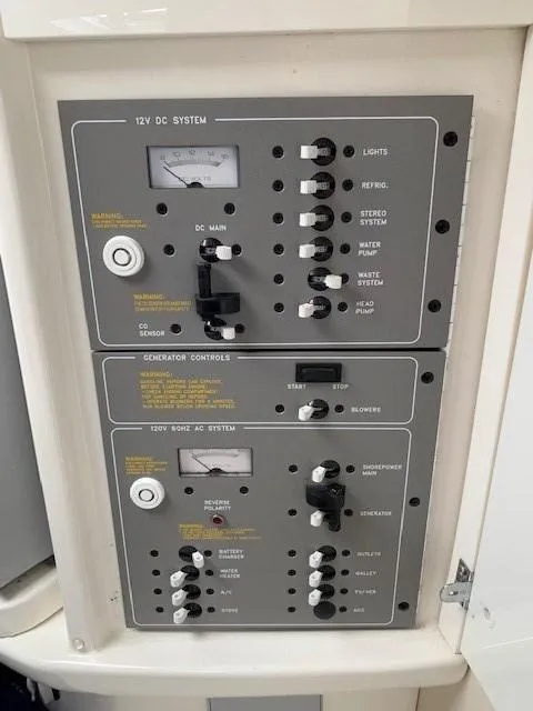 Slide: The Image of Control panel of a 2003 Formula 27 PC boat, featuring 12V DC and AC systems. - 10