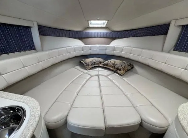 Slide: The Image of Luxurious interior of 2003 Formula 27 PC boat with plush seating and pillows. - 12